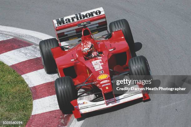 Michael Schumacher of Germany drives the Scuderia Ferrari Marlboro Ferrari F1-2000 Ferrari V10 during the Formula One Canadian Grand Prix on 18 June...