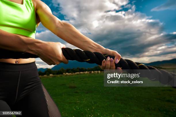 battle rope exercises - battle rope stock pictures, royalty-free photos & images