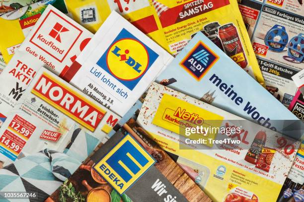 leaflets and flyers of german supermarket chains - edeka stock pictures, royalty-free photos & images