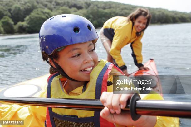 mother and daughter kayaking - two people canoeing on a lake stock pictures, royalty-free photos & images