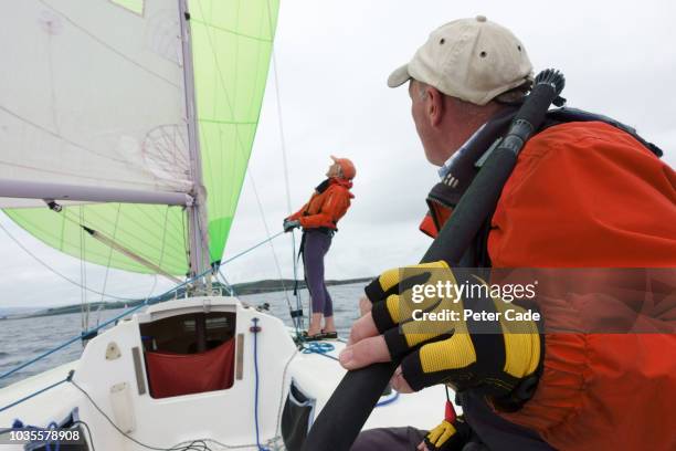 mature couple sailing boat - sailor stockfoto's en -beelden