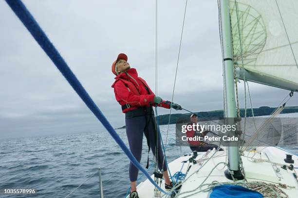 mature couple sailing boat - reliable fotografías e imágenes de stock