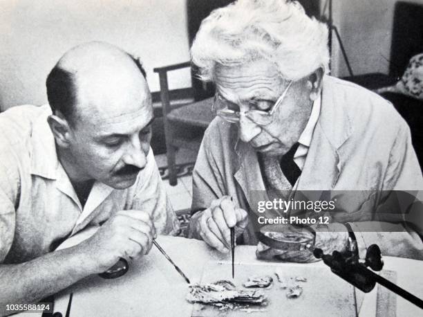 Israel's Professor yigal yadin and james biberkraut study samples from the dead sea scrolls 1965.