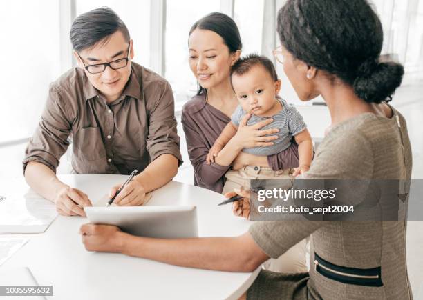 professional family consutation - financial advisor with family stock pictures, royalty-free photos & images