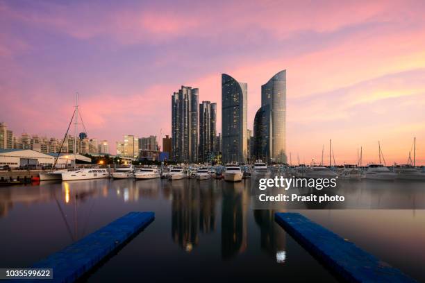 busan city skyline view at haeundae district, gwangalli beach with yacht pier at busan, south korea. - busan bildbanksfoton och bilder