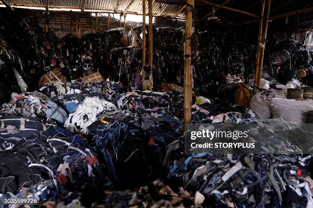 garment leftovers (waste) at a jhoot godown - dhaka division stock pictures, royalty-free photos & images