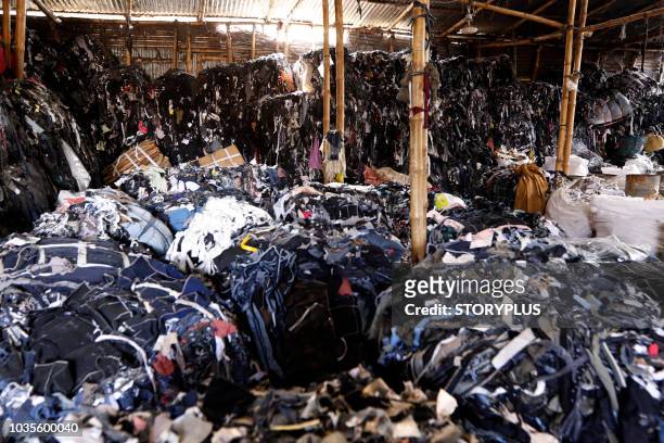 garment leftovers (waste) at a jhoot godown - landfill foto e immagini stock