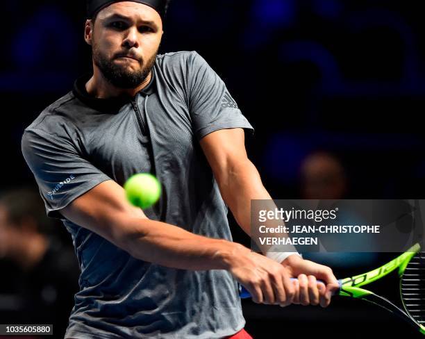 French tennis player Jo-Wilfried Tsonga returns a ball to German tennis player Peter Gojowczyk during their ATP Moselle Open first tour tennis match...