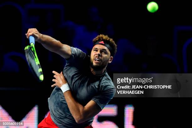 French tennis player Jo-Wilfried Tsonga serves a ball to German tennis player Peter Gojowczyk during their ATP Moselle Open first tour tennis match...