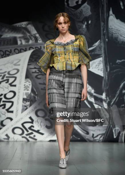 Model walks the runway at the On|Off show during London Fashion Week September 2018 at the BFC Show Space on September 18, 2018 in London, England.