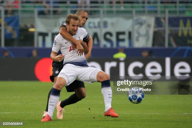 Harry Kane of Tottenham Hotspur competes for the ball with Miranda of FC Internazionale Milano during the UEFA Champions League group B match between...