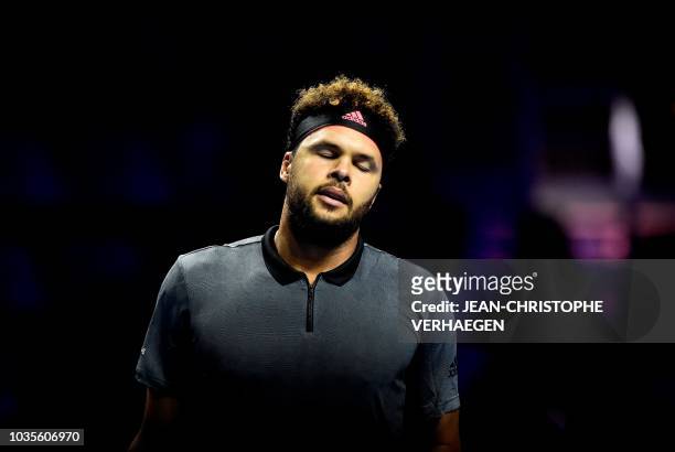 France's Jo-Wilfried Tsonga reacts after losing a point against Germany's Peter Gojowczyk during their ATP Moselle Open first round tennis match on...