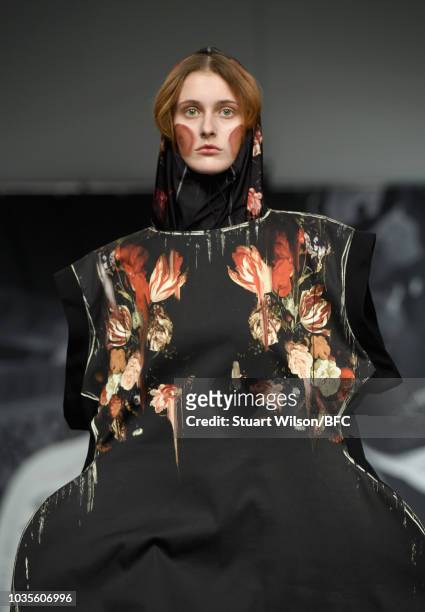 Model walks the runway at the On|Off show during London Fashion Week September 2018 at the BFC Show Space on September 18, 2018 in London, England.