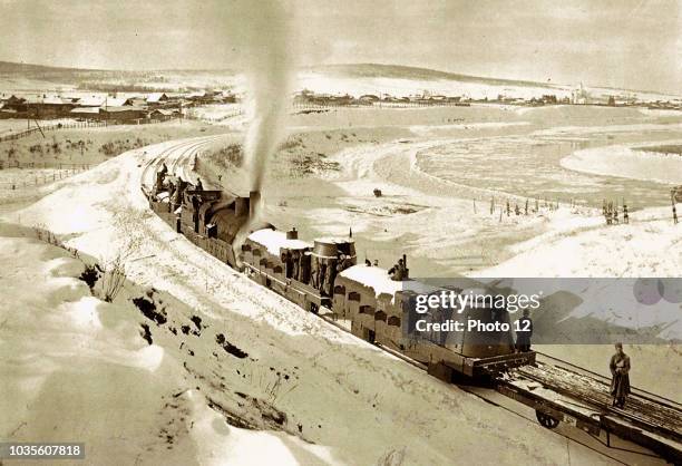 Photograph of an armoured train traveling through Irkutsk, Siberia. Dated 1919.