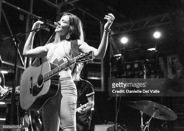 Naomi Cooke of Runaway June performs onstage during Whiskey Jam series '18 outdoor concert at Losers Bar & Grill on September 17, 2018 in Nashville,...
