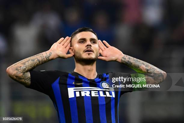 Inter Milan's Argentine forward Mauro Icardi reacts after scoring during the UEFA Champions League group stage football match Inter Milan vs...