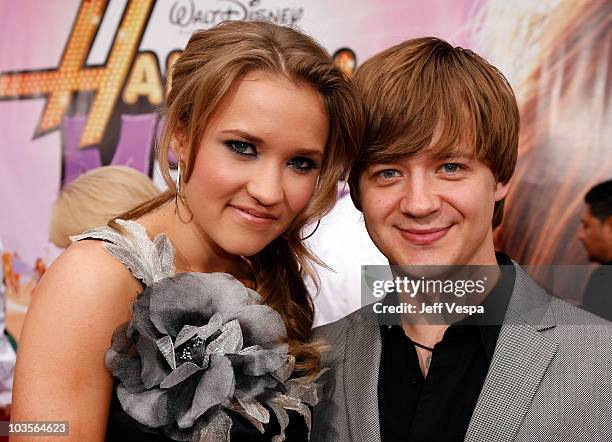Actress Emily Osment and actor Jason Earles arrive at the premiere of Walt Disney Picture's "Hannah Montana: The Movie" held at the El Captian...