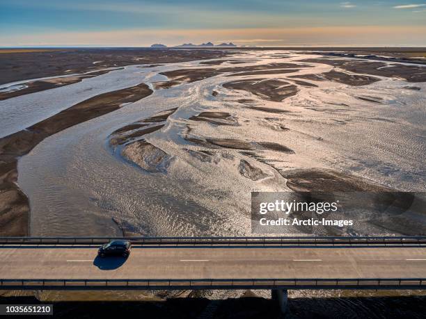 car driving on the markarfljotsbru bridge, markarfljot river, iceland - vestmannaeyjar stock pictures, royalty-free photos & images