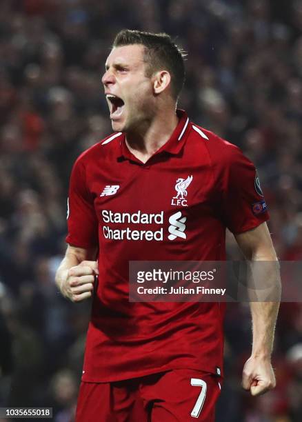 James Milner of Liverpool celebrates after scoring his team's second goal during the Group C match of the UEFA Champions League between Liverpool and...