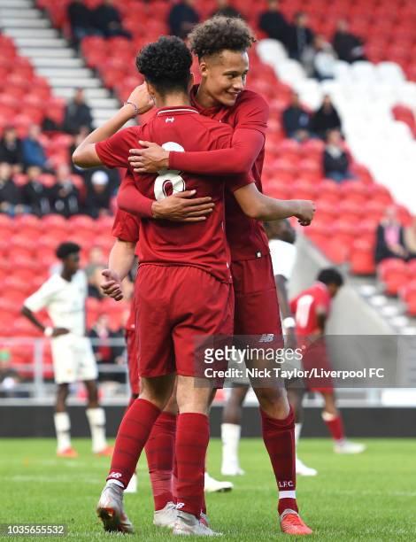 Curtis Jones of Liverpool is congratulated by Rhys Williams after scoring during the UEFA Youth League game at Langtree Park on September 18, 2018 in...