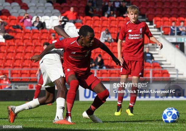 Rafael Camacho of Liverpool and Maxen Kapo of Paris Saint-Germain in action during the UEFA Youth League game at Langtree Park on September 18, 2018...