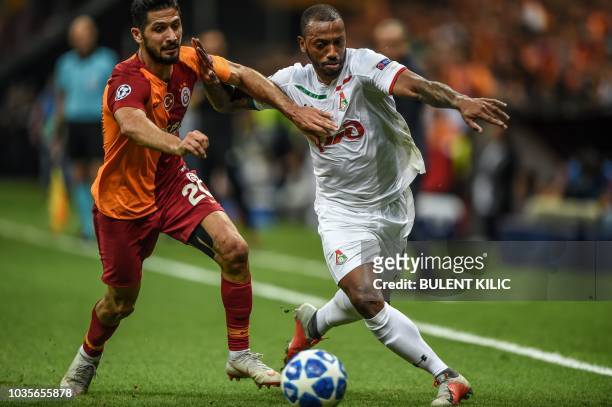 Lokomotiv Moscow's Manuel Fernandez vies with Galatasaray's Emre Akbaba during the UEFA champions league group D football match between Galatasaray...