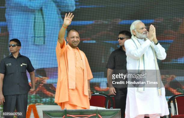 Prime Minister Narendra Modi and Uttar Pradesh Chief Minister Yogi Adityanath during the inauguration of various development projects, at BHUs...