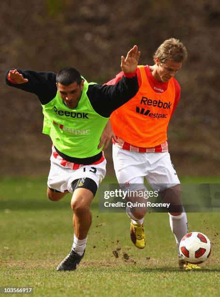 John Aloisi and Matt Thompson of the Heart contest for the ball during a Melbourne Heart training session at Scotch College on August 24, 2010 in...