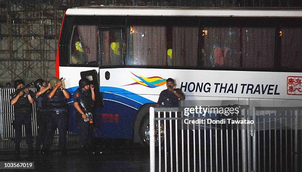 Police assault teams prepare to move in on the bus during a hostage stand-off that resulted in the death of eight hostages and the gunman on August...