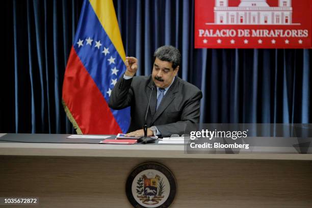 Nicolas Maduro, Venezuela's president, mimics chef Nusret Gokce, known as Salt Bae, during a press conference at the presidential palace in Caracas,...