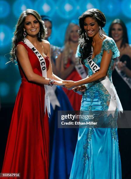 Miss Mexico 2010, Jimena Navarrete , and Miss Jamaica 2010, Yendi Phillipps, hold hands as they wait for the judges' final decision in the 2010 Miss...