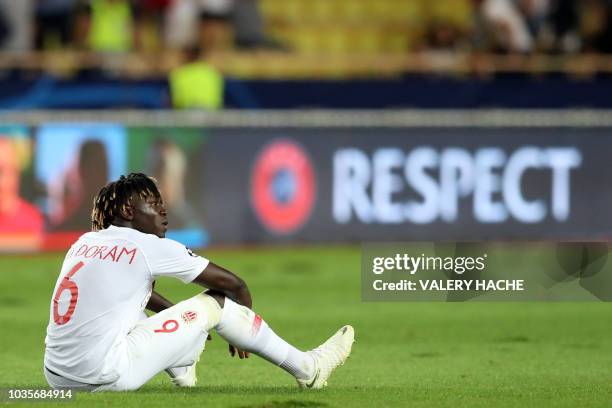 Monaco's French defender Kevin N'Doram reacts at the end of the UEFA Champions League first round football match between AS Monaco and Atletico...