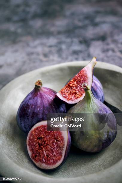 fresh figs on rustic background - fig stock pictures, royalty-free photos & images