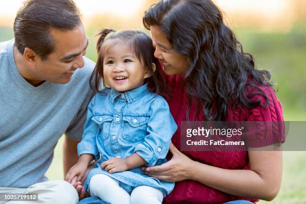 happy filipino family of three - philippines stock pictures, royalty-free photos & images