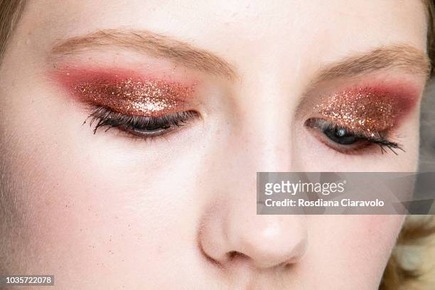 Model, make up detail, is seen backstage ahead of the Luisa Spagnoli show during Milan Fashion Week Spring/Summer 2019 on September 18, 2018 in...
