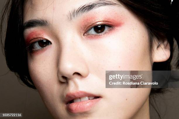 Model, make up detail, is seen backstage ahead of the Luisa Spagnoli show during Milan Fashion Week Spring/Summer 2019 on September 18, 2018 in...