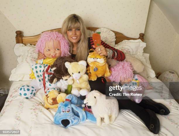 English model and pop singer Mandy Smith with a collection of stuffed toys, circa 1986.