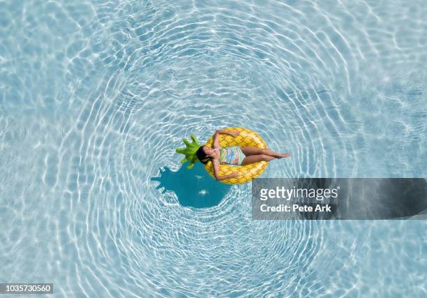 pineapple float - swimming pool stock pictures, royalty-free photos & images