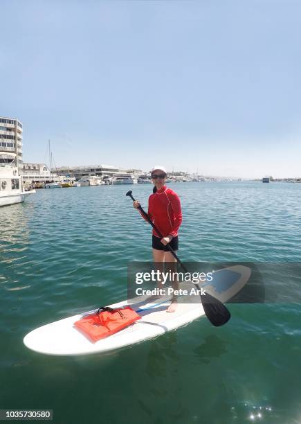 standup paddleboarding - newport beach harbor stock pictures, royalty-free photos & images