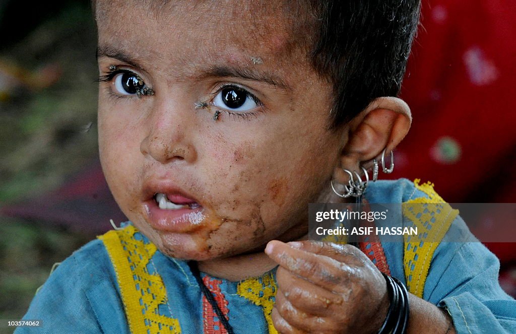 A Pakistani child eats breakfast at a ma