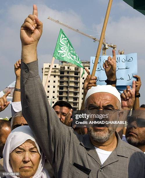 Sheikh Raed Salah , head of the radical wing of the Islamic Movement in Israel, stands next to his mother Laqia as gestures upob arrival at Ramla...