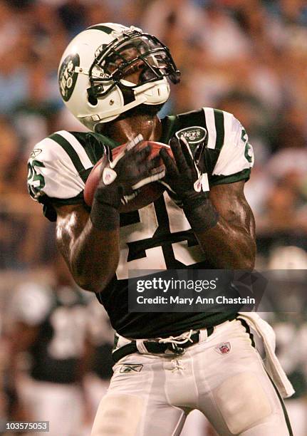 Joe McKnight of the New York Jets catches the football on a kick return during their preseason game against the Carolina Panthers at Bank of America...