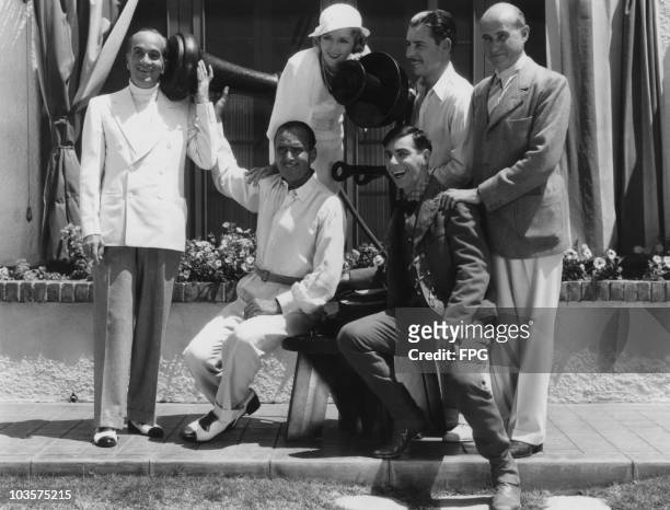 Actress Mary Pickford pictured with actors Al Jolson , Douglas Fairbanks , Eddie Cantor , Ronald Colman and film producer Samuel Goldwyn , grouped...