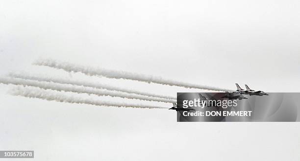 16s from the US Air Force Thunderbirds flight demonstration squadron fly up the Hudson River as part of a fly-over during a ceremony at the Intrepid...