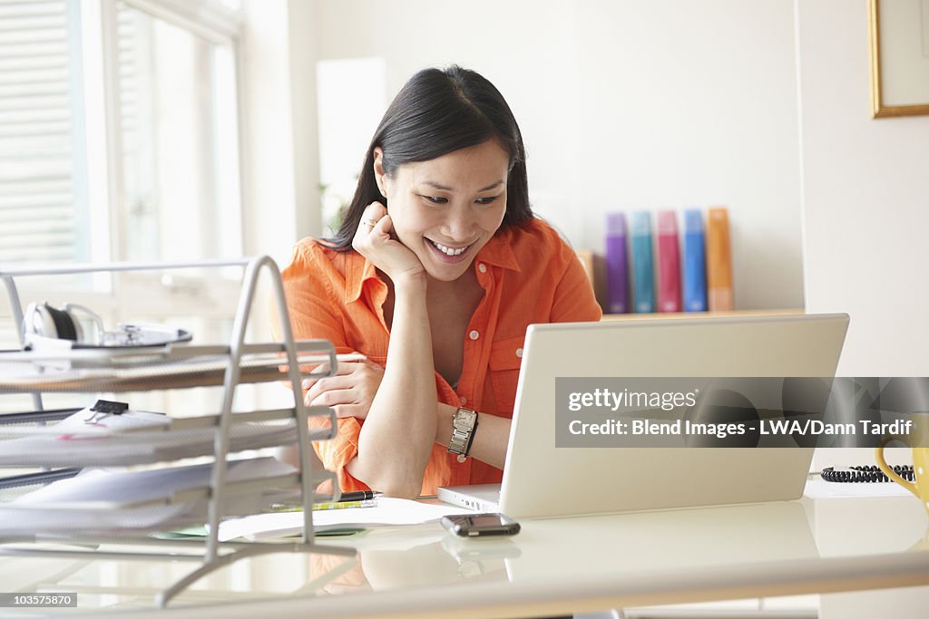 Chinese businesswoman working at desk