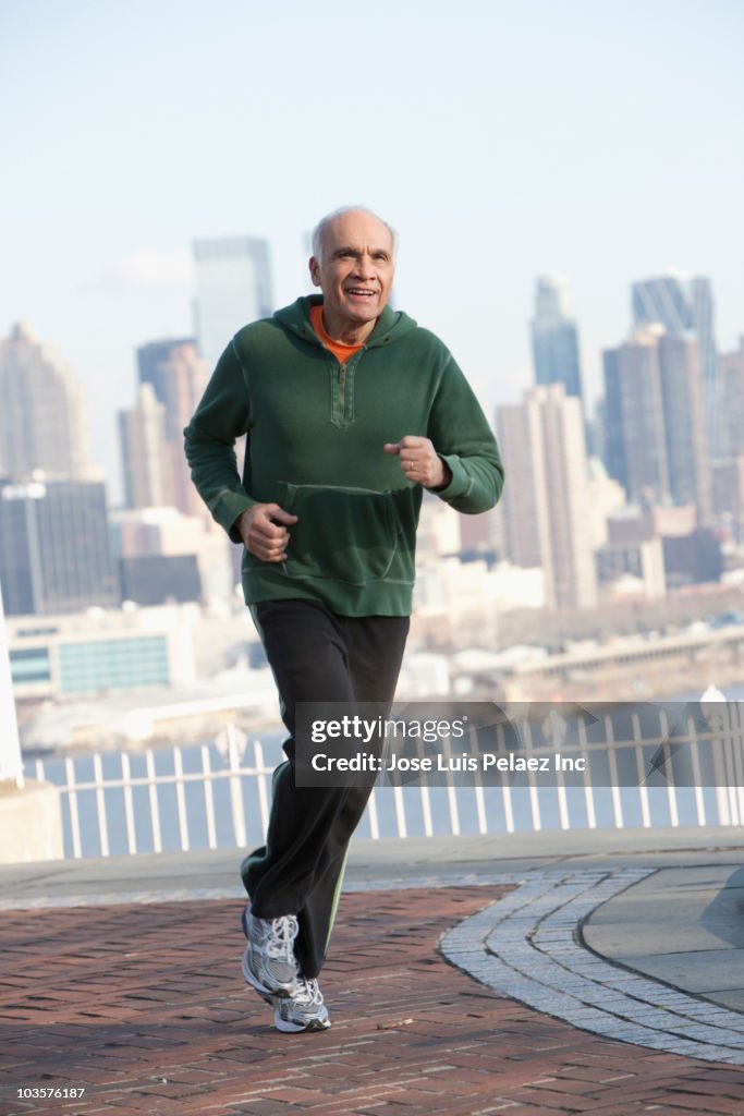 Hispanic man running in urban setting