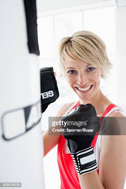 woman boxing - punching bag stock pictures, royalty-free photos & images