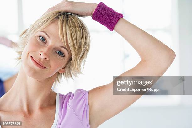 woman  stretching neck - sweat band stock pictures, royalty-free photos & images