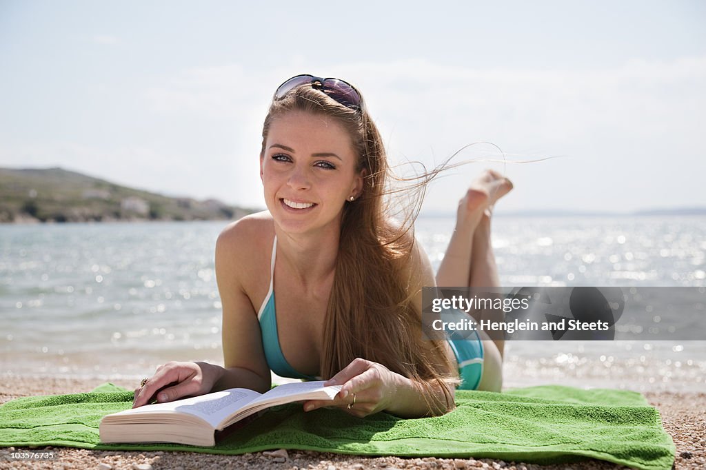 Woman reading at the beach