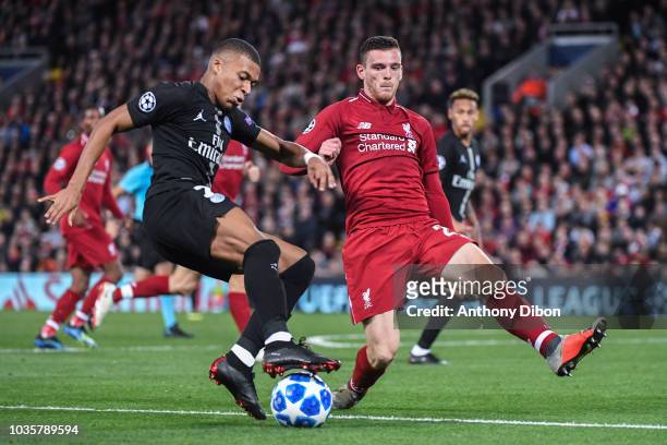 Kylian Mbappe and Andy Robertson of Liverpool during the Champions League match between Liverpool and Paris Saint Germain at Anfield on September 18,...